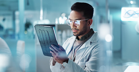 Image showing Tablet, thinking or scientist with research in laboratory for a chemistry report or medical test feedback. Asian man, person typing or science update for online medicine development news on website