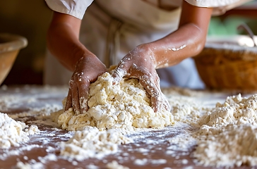 Image showing Person Kneading Dough on Table, Preparing Bread Recipe at Home Kitchen