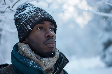 Image showing Man Wearing Hat and Scarf in Snow, Winter Outdoor Scene With Cold Weather Attire