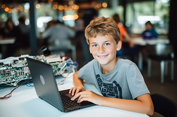 Image showing Young Boy Sitting in Front of Laptop Computer to Learn and Explore