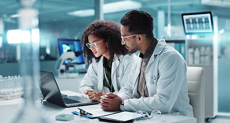 Image showing Science, teamwork and scientist with laptop in laboratory for communication, pharmaceutical review or planning. Employees, collaboration and technology for research, discussion and digital analysis