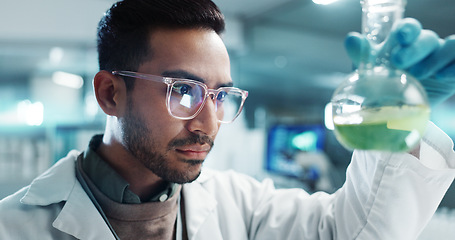 Image showing Serious man, scientist and beaker with chemical for research, experiment or test in lab. Science, medical professional and shake glass for development of cure, biotechnology and study for healthcare