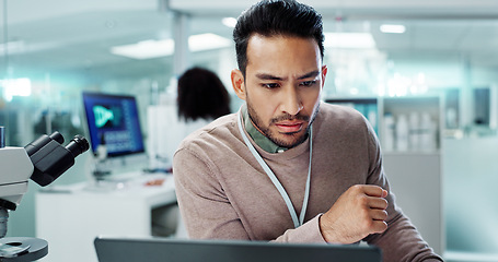 Image showing Scientist, man thinking and research on computer for laboratory test, exam or medical results of DNA. Asian science expert or people on laptop and biotechnology for cancer solution or problem solving