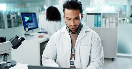 Image showing Scientist, man and reading computer for laboratory test, typing report or medical results of DNA at night. Asian expert thinking on computer for science research, biotechnology and molecule analysis