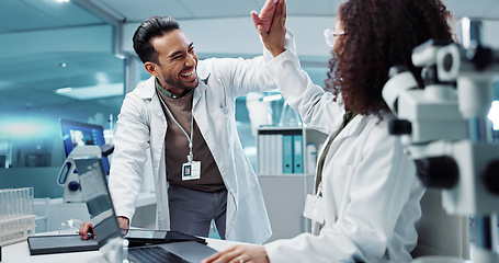 Image showing Scientist, teamwork and high five with laptop in laboratory for test breakthrough, pharmaceutical review or success. Science, collaboration or technology for research, discussion and digital analysis