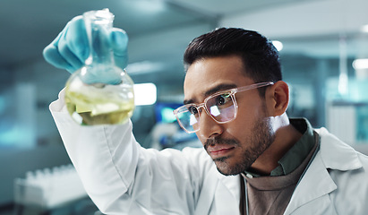 Image showing Man, scientist and shake beaker with chemical for research, experiment or test in lab. Science, serious or medical professional with glass for development of cure, biotechnology or study healthcare