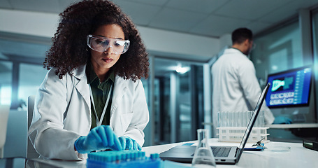 Image showing Woman, scientist or blood vial for exam in laboratory, healthcare or pathology to label on test tube. Biotechnology, pharmaceutical and laptop by doctor and online scientific results in phlebotomy