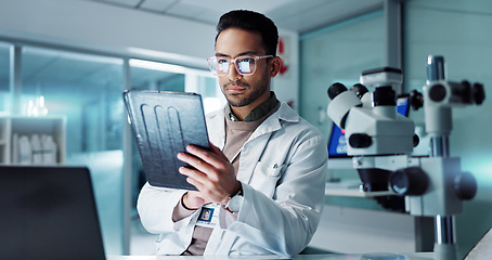 Image showing Tablet, scientist and reading for analysis in laboratory, healthcare and online pharmaceutical research . Asian expert, computer and microscope for medicine and information on innovation cure at work