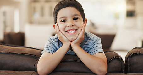 Image showing Happy, cute and face of a child on the sofa for playing, relax and weekend fun. Smile, youth and portrait of a little boy kid with an adorable expression, charming and on vacation on the couch