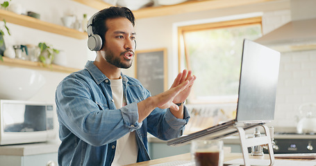 Image showing Remote work from home, video call and man with a laptop, internet connection or conference call. Male person, entrepreneur or speaker with a pc, conversation or webinar with conversation in a kitchen