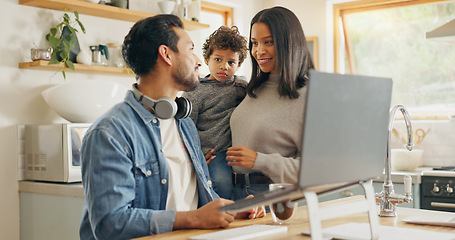 Image showing Kitchen, talking and family with a laptop, internet connection and communication with network, remote work from home and website information. Parents, mother or father with male child with technology