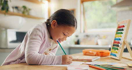 Image showing Learning, writing and happy girl child in a kitchen with maths, homework or counting practice in her home. Education, creative and kid student smile while drawing on table for homeschool art lesson