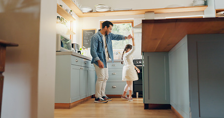 Image showing Support, love and ballet girl bonding with father in a kitchen together, excited and playing as a dancer pr ballerina. Tutu, dad and man dancing with kid with motivation or happiness in house or home