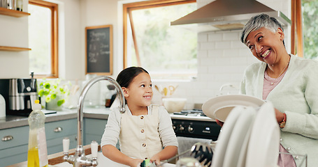 Image showing Happy, grandmother and child washing dishes with help, teaching and learning from a senior. Smile, support and an elderly woman and a girl kid cleaning the kitchen together in a house for routine