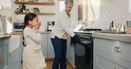 Image showing Kitchen, food and grandmother cooking with child learning to prepare dinner, supper or lunch in a home. Grandchild, support and grandma baking with kid or girl and happy for a fresh meal together