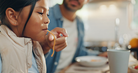 Image showing Father, children and a girl eating spaghetti with her family in the dining room of their home together for supper. Food, kids and parents around a table for a meal, bonding over dinner in a house