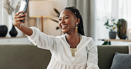 Image showing Smile, selfie and black woman with peace sign, funny face and relax on sofa in living room. V hand, picture and happy African person or influencer at home on couch on social media with tongue out