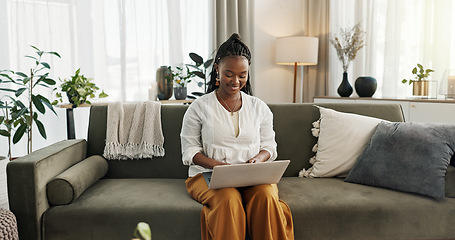 Image showing Black woman on sofa, smile and typing on laptop for remote work, social media or blog post research in home. Happy girl on sofa with computer checking email, website or online chat in living room.