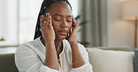 Image showing Headache, stress and young black woman in the living room of her modern apartment on weekend. Burnout, mental health and sick African female person with migraine for illness in lounge at home.