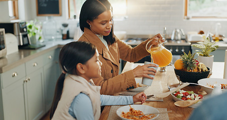 Image showing Woman, girl and juice with family and eating together in kitchen, nutrition and bonding with food. People at home, hungry and female child excited with drink and wellness happy with dinner meal