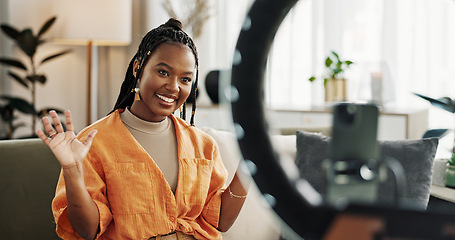 Image showing Wave, live streaming and happy black woman with box or product in home living room. Hello, influencer and person with package, record video on social media and content creation, ring light and phone