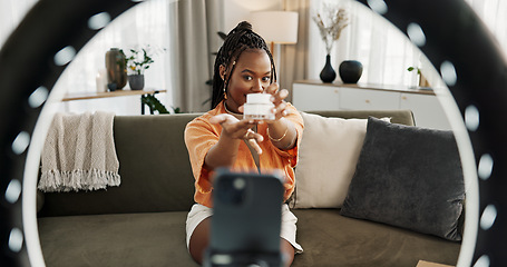 Image showing Video, influencer and black woman doing skincare for tutorial on social media or the internet. Dermatology, happy and young African female person filming or live streaming facial routine at home.