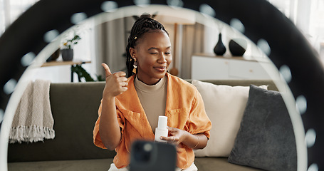 Image showing Video, influencer and black woman doing skincare for tutorial on social media or the internet. Dermatology, happy and young African female person filming or live streaming facial routine at home.