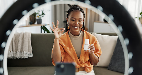 Image showing Video, content creator and black woman doing skincare for tutorial on social media or the internet. Dermatology, happy and African female influencer filming or live streaming face routine at home.