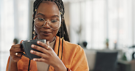 Image showing Calm, cup of coffee and black woman in the living room of her modern apartment in the morning. Peaceful, mug and young African female person drinking caffeine or latte in her home on weekend.