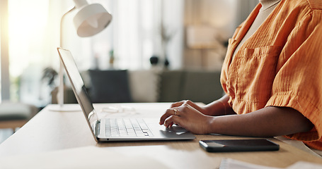 Image showing Hands of woman at desk, typing and laptop for remote work, social media or blog post research with in home office. Freelance girl with computer writing email, website or online chat in apartment.