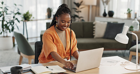 Image showing Black woman, typing in home office and laptop for research in remote work, social media or blog in apartment. Freelance girl at desk with computer writing email, website post and online chat in house