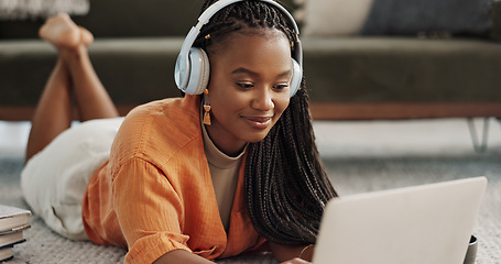 Image showing Home, smile and black woman with a headphones, streaming music or sound in a living room. African person on a sofa, apartment or girl with headset, listening to audio or relax with happiness or song