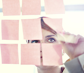 Image showing Businesswoman, sticky notes and glass wall for planning, thinking and vision for logistics and ideas. Employee, brainstorming and mockup for meeting, goals and teamwork for project management