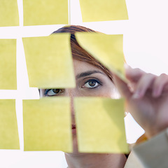 Image showing Employee, sticky notes and glass wall for thinking, planning and vision for logistics and ideas. businesswoman, brainstorming and management for meeting, goal and seo with decisions for marketing