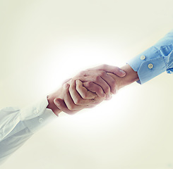 Image showing Low angle, business people and handshake with partnership, agreement and promotion. B2b deal, shaking hands and thank you with mockup space or cooperation for a project or collaboration with contract