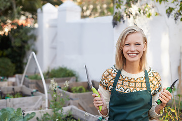 Image showing Gardening, happy and portrait of woman with tools for landscaping, planting flowers and growth. Agriculture, nature and person outdoors with equipment for environment, ecology and nursery in garden