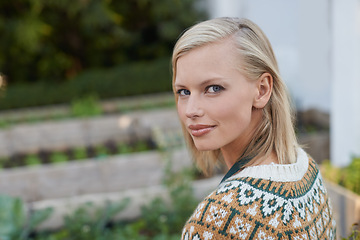 Image showing Gardening, happy and portrait of woman with plants for landscaping, planting flowers and growth. Agriculture, nature and face of person outdoors for environment, ecology and nursery in garden