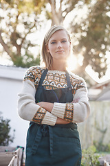 Image showing Gardening, crossed arms and portrait of woman with plants for landscaping, planting flowers and growth. Agriculture, nature and person for outdoor environment, ecology or nursery in garden in morning