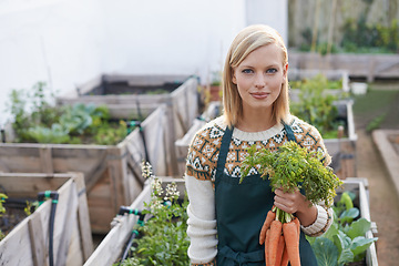 Image showing Garden, carrot and portrait of woman with plants for landscaping, planting flowers and growth. Agriculture, nature and happy person with vegetables outdoors for environment, nursery and gardening