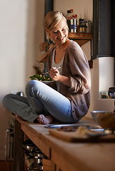 Image showing Happy, woman and eating salad in kitchen at home, nutrition and fresh leafy greens for healthy diet. Vegetables, bowl and smile of hungry person with food, lunch or organic vegan meal for wellness