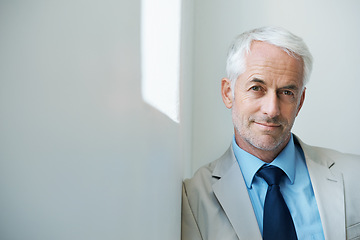 Image showing Portrait, mature man and corporate in suit with copy space, confidence and serious look with determination at office. Businessman, executive and professional with experience, wisdom and success.