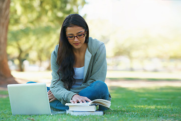 Image showing Laptop, lawn or woman in nature reading books for learning knowledge, information or education. Research, textbook or female student in park on grass for studying or typing online on college campus