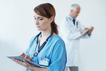 Image showing Tablet, research and woman nurse in hospital for medical diagnosis, surgery or treatment. Digital technology, information and female healthcare worker reading on internet in medicare clinic.