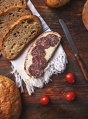 Image showing Slice bread with butter and salami