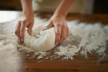 Image showing Hands, dough and wheat flour on table at bakery, bread or pizza with meal prep, catering and cooking. Culinary, chef or baker person with pastry preparation, ingredients and food for nutrition