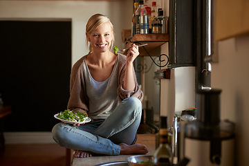 Image showing Woman, kitchen and salad with wellness, portrait and home for nutrition, vegetables and diet. Designer, house and lunch for health, smile and relaxation and break for wellbeing, rest and happiness