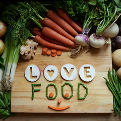 Image showing Cutting, board and vegetables for healthy food, cooking and preperation of soup ingredients on table above. Culinary, organic and green groceries for vegetarian love, health and wellness background