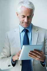 Image showing Mature, businessman and tablet for online networking as law attorney as corporate professional, email or reading. Male person, employee and internet in office for connect planning, startup or Canada