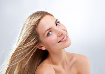 Image showing Smile, hair and portrait of woman in studio with natural makeup, beauty and straight hairstyle. Haircare, cosmetics and happy model with keratin growth, wind and face of girl on white background.