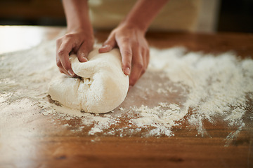 Image showing Hands, dough and wheat flour on kitchen counter at bakery, bread or pizza with meal, catering and cooking. Culinary, chef or baker person with pastry preparation, ingredients and food for nutrition